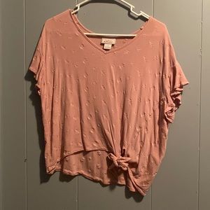 Light salmon pink top with ruffled short sleeves